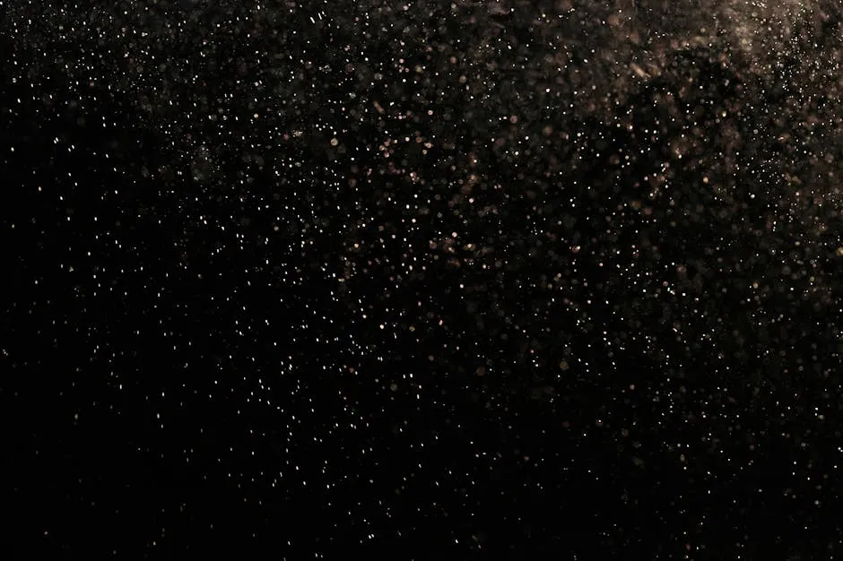 White Dust Particles on Black Background