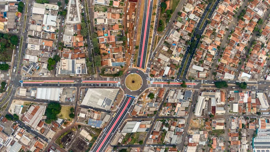 Drone Shot of a Roundabout and Houses in a City 