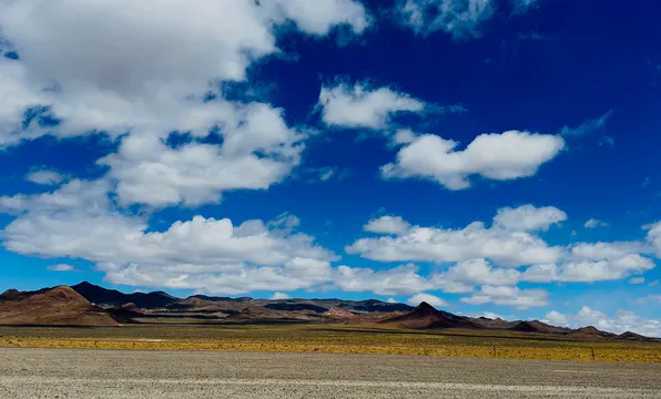 Horizontal video: Vast desert landscape under blue sky 28713590. Duration: 15 seconds. Resolution: 3352x2026