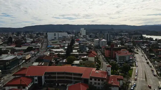 Horizontal video: Aerial view of urban cityscape with mountain backdrop 28739641. Duration: 38 seconds. Resolution: 3840x2160
