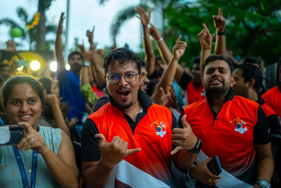 Excited Fans Cheering for Sports Team Outdoors