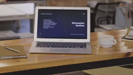 Horizontal video: An open laptop over the table shows agenda to tackle in the workplace 3249804. Duration: 12 seconds. Resolution: 3840x2160