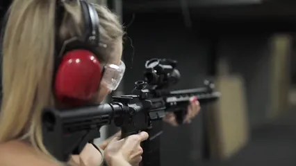 Horizontal video: Woman shoots at target 5243090. Duration: 10 seconds. Resolution: 1920x1080