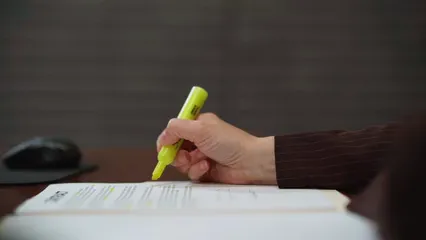 Horizontal video: Person reviewing a contract 7841607. Duration: 7 seconds. Resolution: 1920x1080