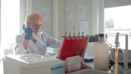Horizontal video: A female technician working at a laboratory 8940769. Duration: 18 seconds. Resolution: 3840x2160