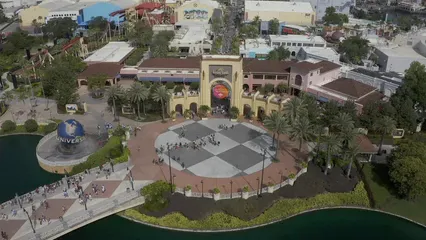 Horizontal video: Drone footage of people at the universal studios 9431938. Duration: 8 seconds. Resolution: 2688x1512
