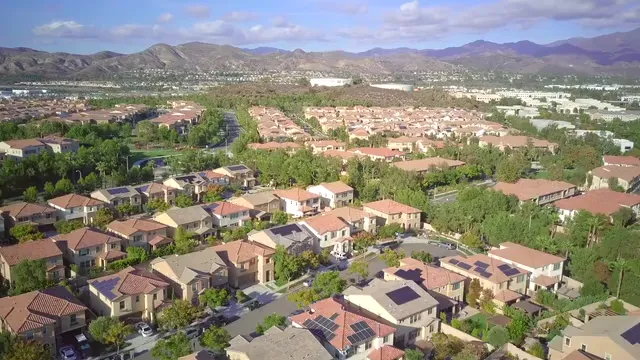 Horizontal video: Drone footage of residential area 9875908. Duration: 17 seconds. Resolution: 3840x2160