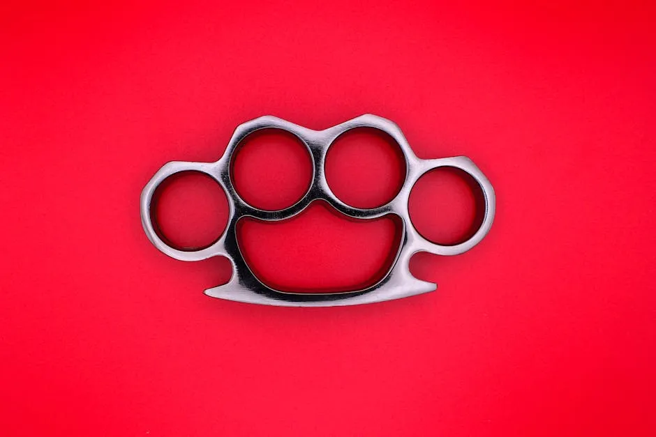 Brass Knuckle on Red Background