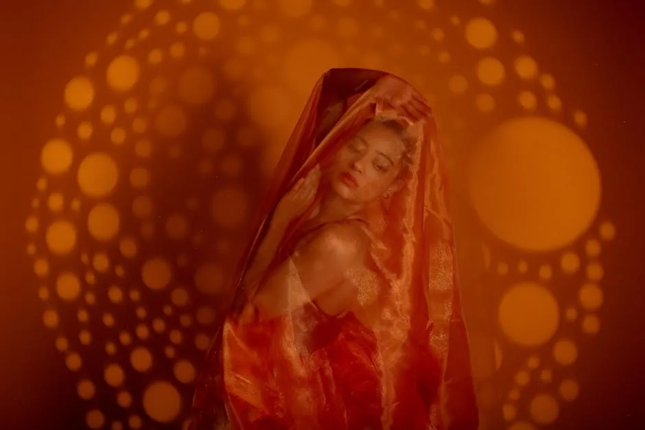 Artistic Portrait of Woman Draped in Orange Fabric