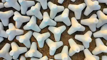 Horizontal video: Drying concrete cast tetrapods under the sun 3214301. Duration: 54 seconds. Resolution: 3840x2160