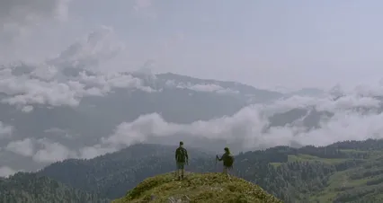 Horizontal video: A couple reaching the mountain summit 4763869. Duration: 26 seconds. Resolution: 4096x2160