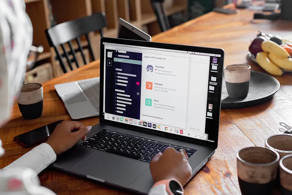 Person Using Laptop on Table