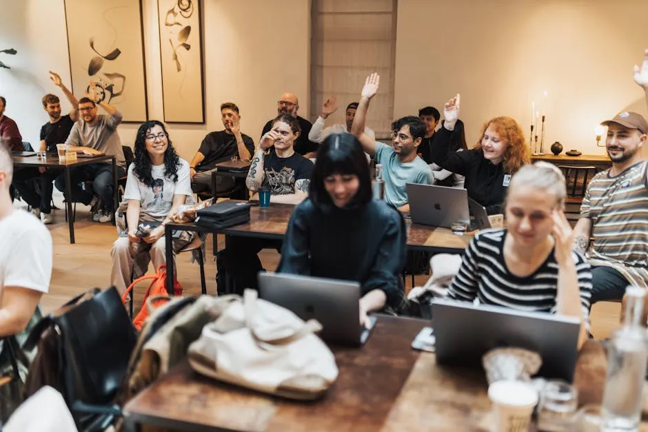 People Sitting with Arms Raised in Meeting in Office