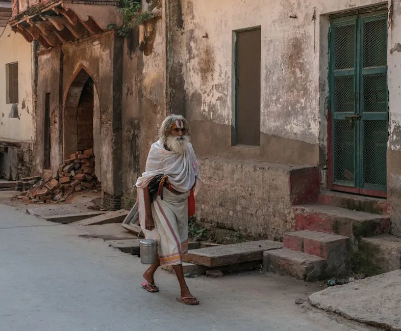 Elderly Indian Man Walking in Mathura Street