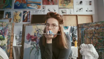 Horizontal video: Woman holding a paintbrush 5008849. Duration: 11 seconds. Resolution: 3840x2160