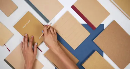Horizontal video: Close up view of a person writing on notebook 5190601. Duration: 42 seconds. Resolution: 4096x2160