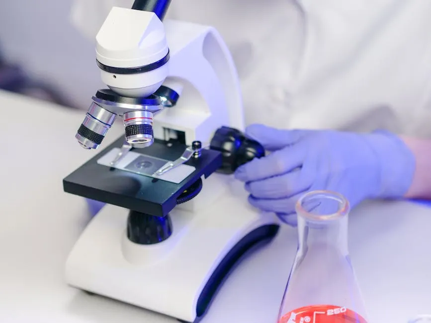 Close-Up View of a Person Examining a Microscope Slide