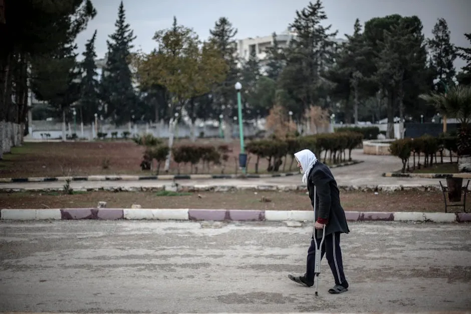 Woman in Hijab Walking on Crutches on Street