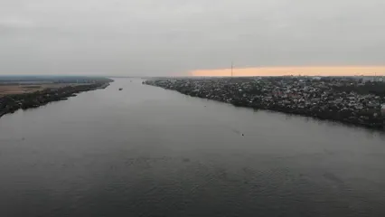Horizontal video: Drone footage of a city on a river bank 12749523. Duration: 56 seconds. Resolution: 2720x1530