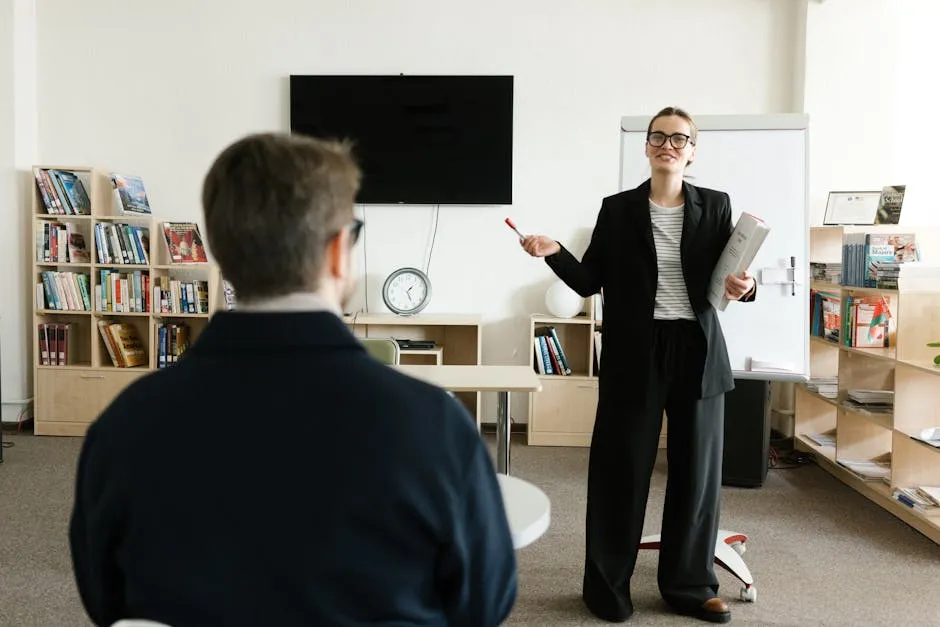 A Woman Talking in Front of a Class