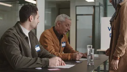 Horizontal video: Men facilitating voting elections 7103531. Duration: 16 seconds. Resolution: 3840x2160