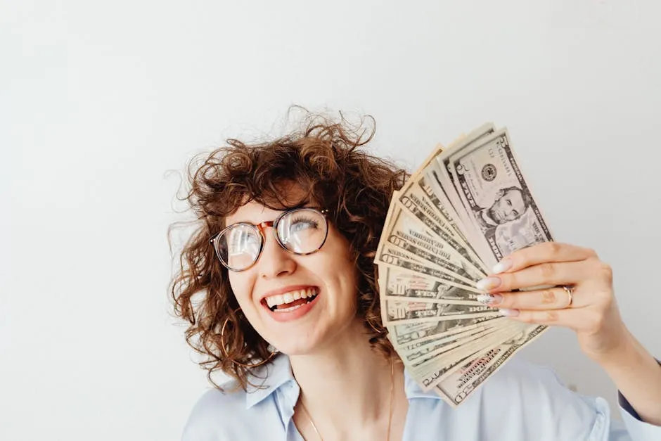A Woman Holding Us Dollar Bills 