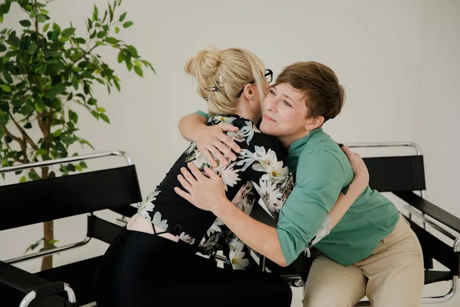 Women Hugging in a Therapy Office 