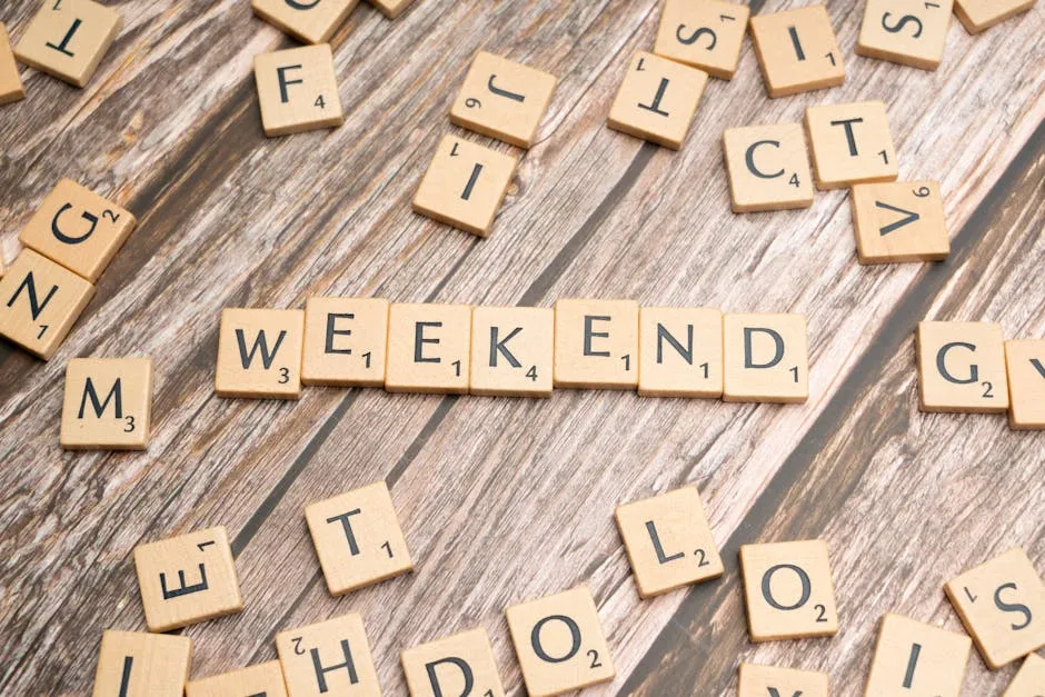 Scrabble letters spelling the word weekend on a wooden table