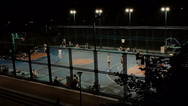 Horizontal video: Nighttime basketball game under stadium lights 28729204. Duration: 30 seconds. Resolution: 3840x2160