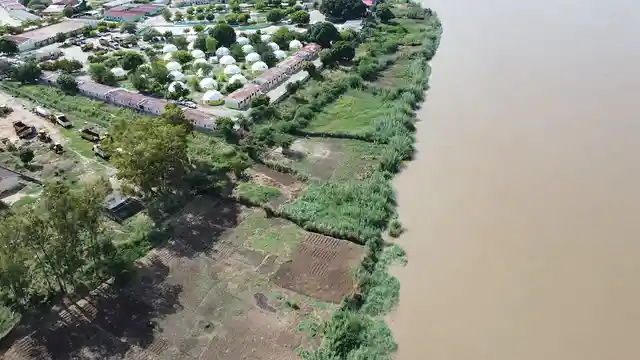 Horizontal video: Aerial view of riverside settlement landscape 28750873. Duration: 74 seconds. Resolution: 2720x1530