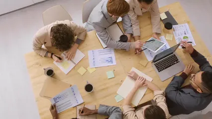Horizontal video: A man showing to a group the data on his laptop 3249454. Duration: 20 seconds. Resolution: 3840x2160
