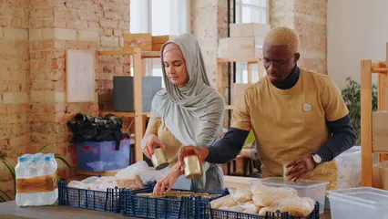Horizontal video: Volunteers packing foods to donate 6893982. Duration: 11 seconds. Resolution: 3840x2160