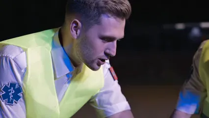 Horizontal video: Close up footage of a paramedic talking 8944166. Duration: 10 seconds. Resolution: 1920x1080