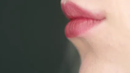 Horizontal video: A woman brushing on red color lipstick on her lips 3181676. Duration: 24 seconds. Resolution: 3840x2160