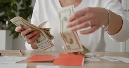 Horizontal video: A woman feeling ecstatic in gathering her money 5981455. Duration: 20 seconds. Resolution: 4096x2160