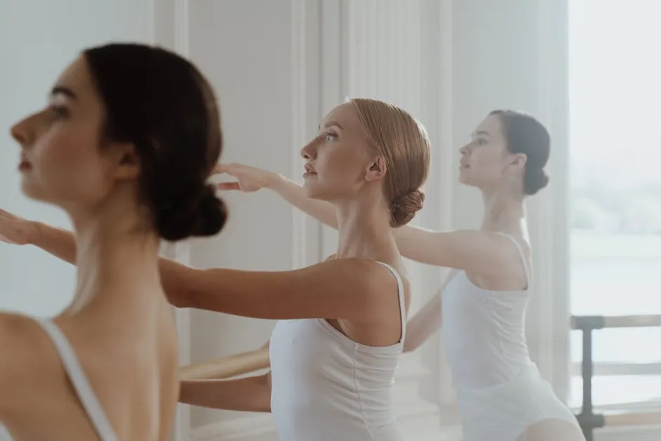 Female Ballet Dancers performing on a Practice Room