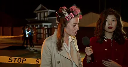 Horizontal video: Journalist interviewing woman at crime scene 10464824. Duration: 35 seconds. Resolution: 4096x2160