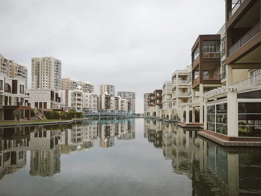 Modern Residential Buildings Reflecting in Canal