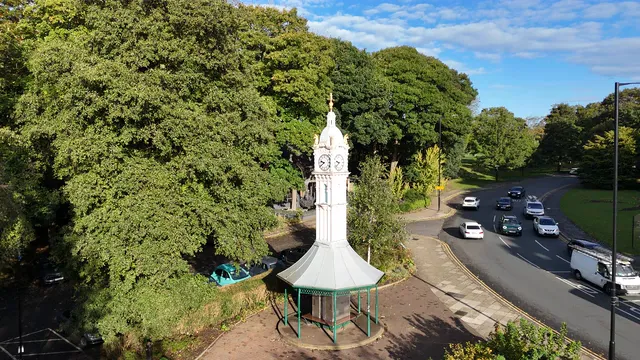 Horizontal video: Aerial view of clock tower in halifax park 28872023. Duration: 9 seconds. Resolution: 3840x2160