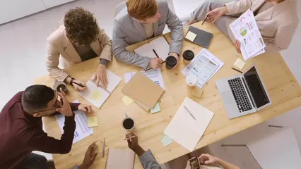 Horizontal video: A group of people discussing a chart in a business meeting 3248067. Duration: 27 seconds. Resolution: 3840x2160