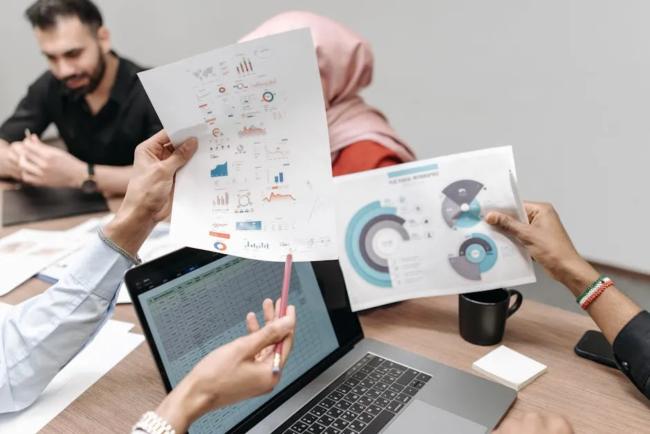 Persons Holding Graphs and Data on White Papers