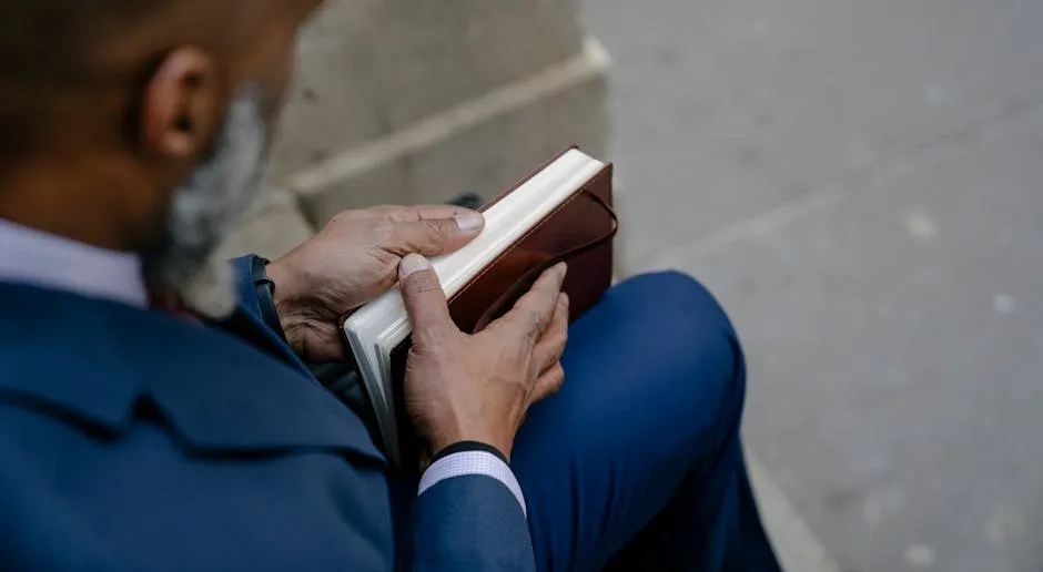 Man Opening a Book