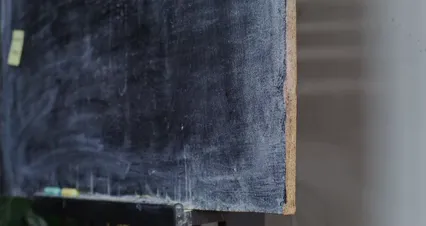 Horizontal video: A person putting a sticky note on a blackboard 8471615. Duration: 9 seconds. Resolution: 4096x2160