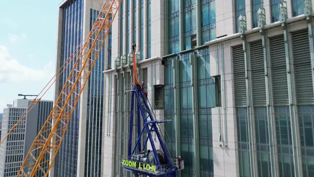 Horizontal video: City skyscraper construction with crane in action 28692141. Duration: 17 seconds. Resolution: 3840x2160
