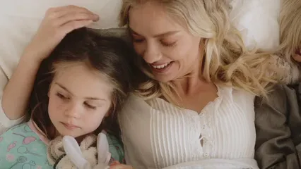 Horizontal video: A mother sandwiched by her children lying in the bed 3201102. Duration: 10 seconds. Resolution: 1920x1080