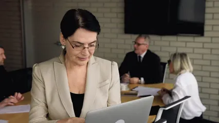 Horizontal video: Woman standing using a laptop 7552649. Duration: 15 seconds. Resolution: 1920x1080