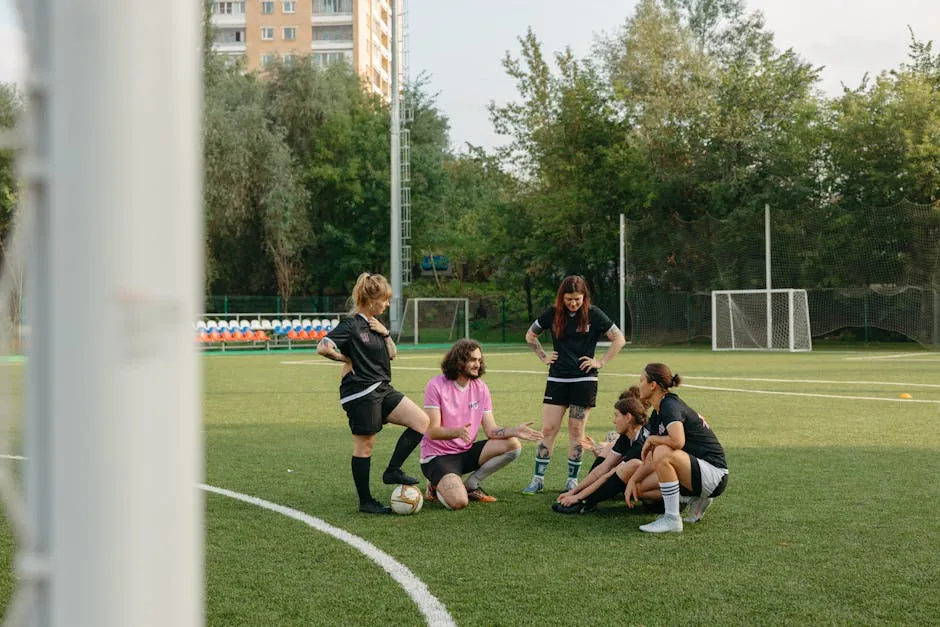 Team of Football Players Together with Their Coach