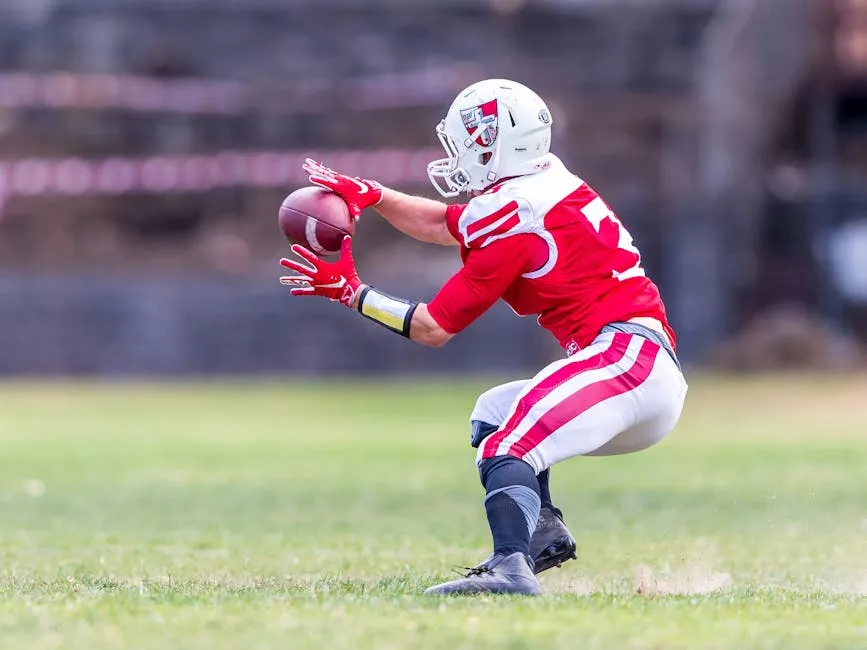 Nfl Player Catching Football