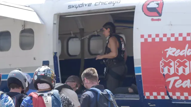 Horizontal video: A group of people getting off of a small plane 28305728. Duration: 18 seconds. Resolution: 1920x1080