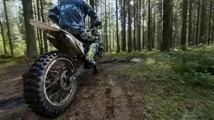 Horizontal video: Areial footage of two motorcyclists in the woods 5803089. Duration: 12 seconds. Resolution: 3840x2160